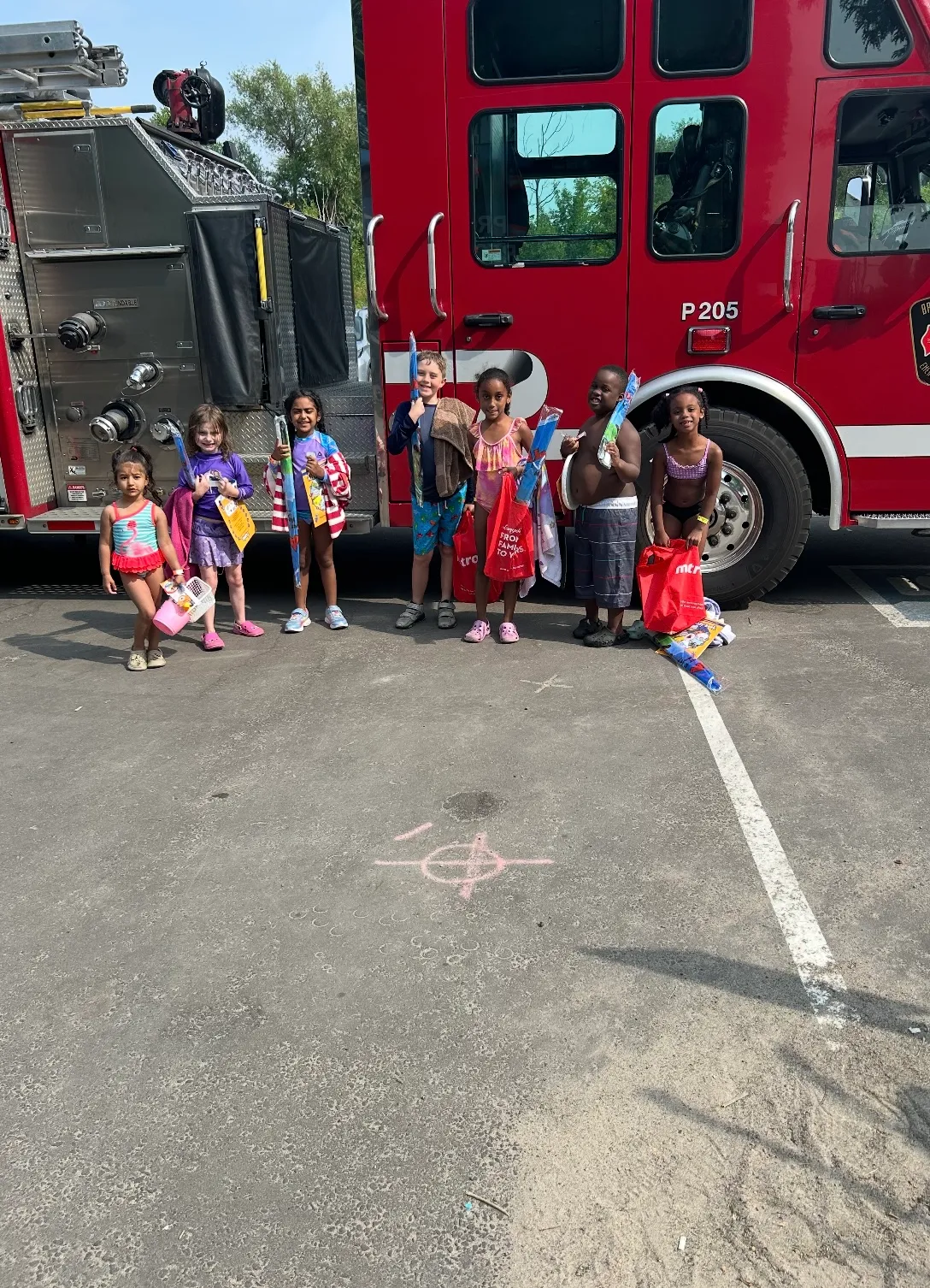 Photo of daycare kids beside stalled fire truck